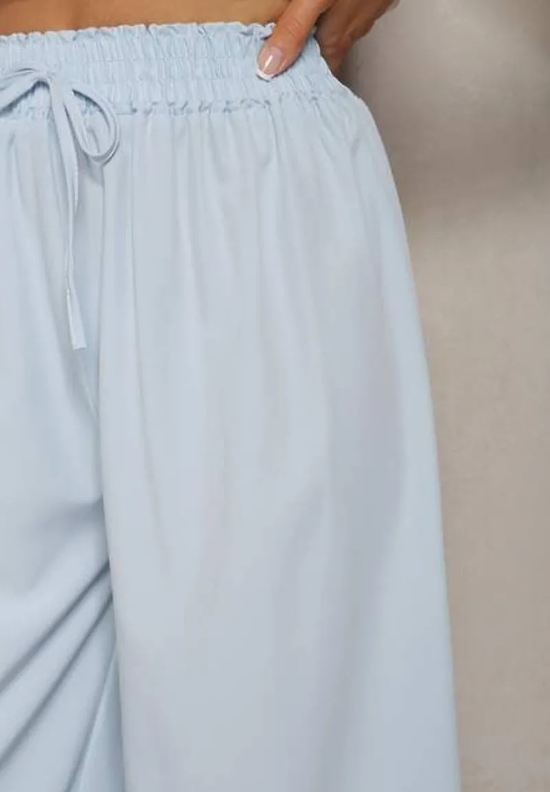 Jasnoniebieskie Spodnie High Waist z Szerokimi Nogawkami z Wiskozą Wykończone Gumką w Talii Crisantas